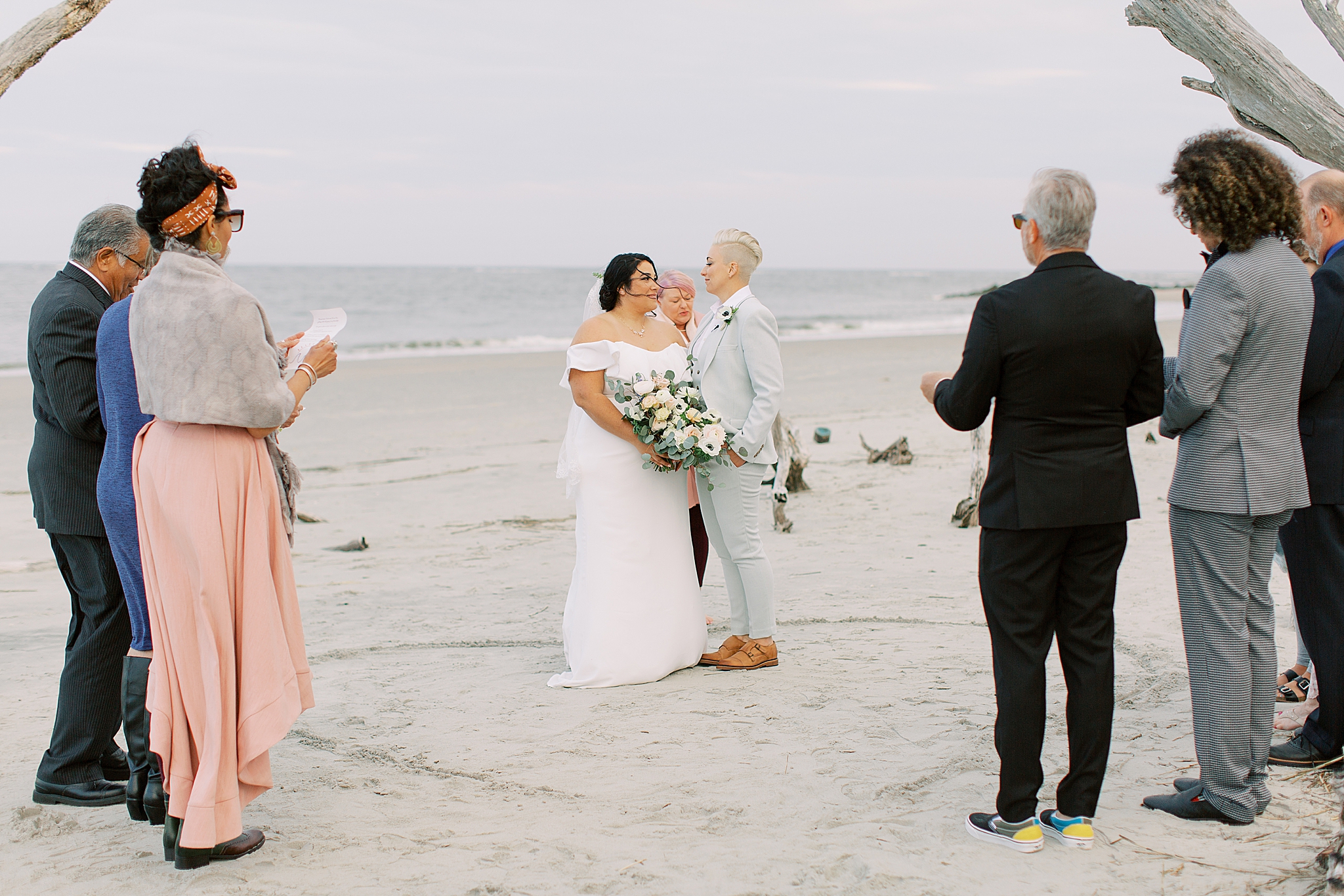 couple kisses on the beach during Charleston Microwedding