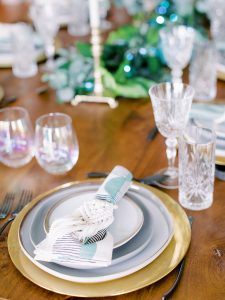 intimate wedding reception tablescape with gold and blue details