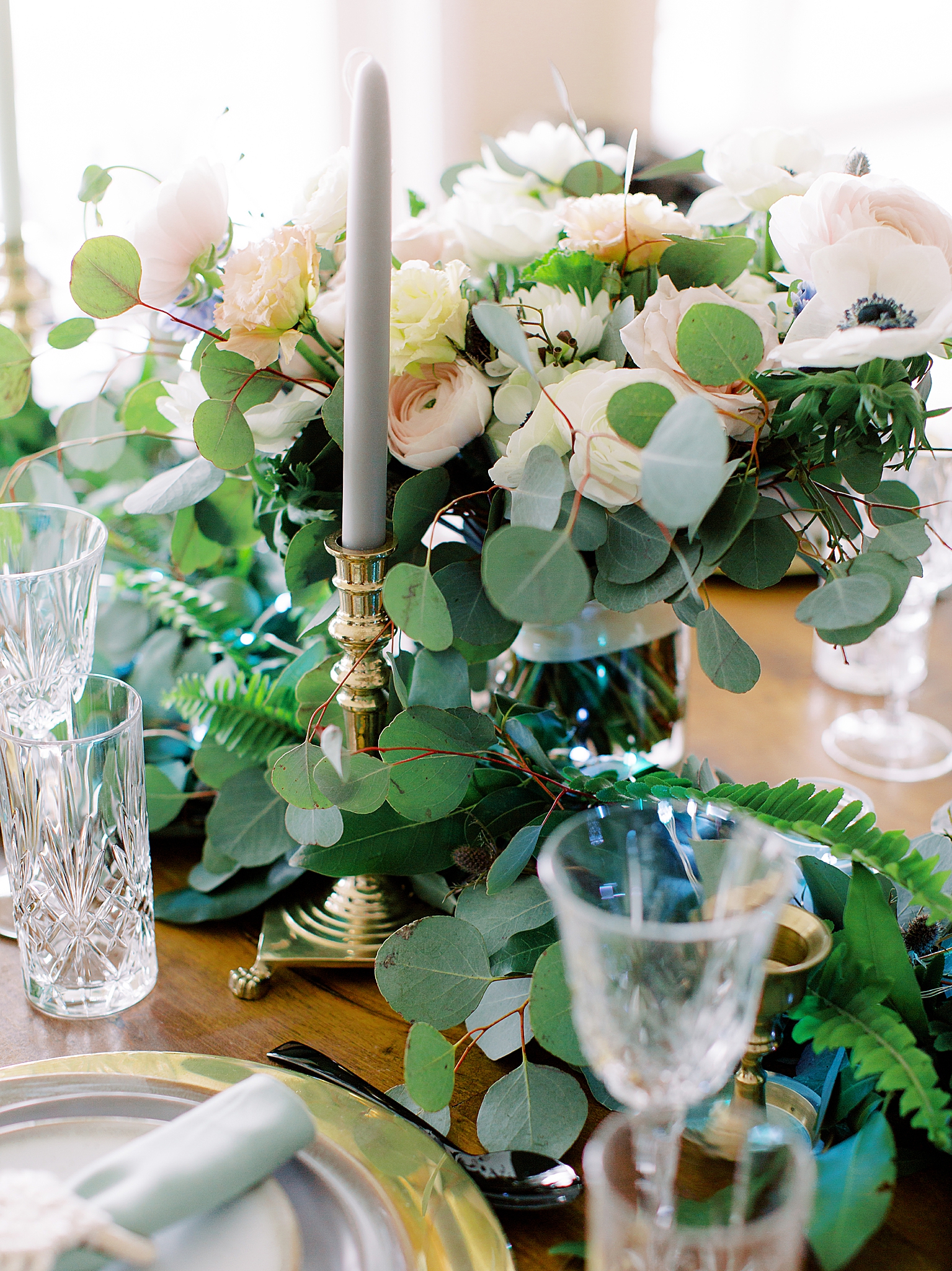 wedding reception with green and gold centerpieces