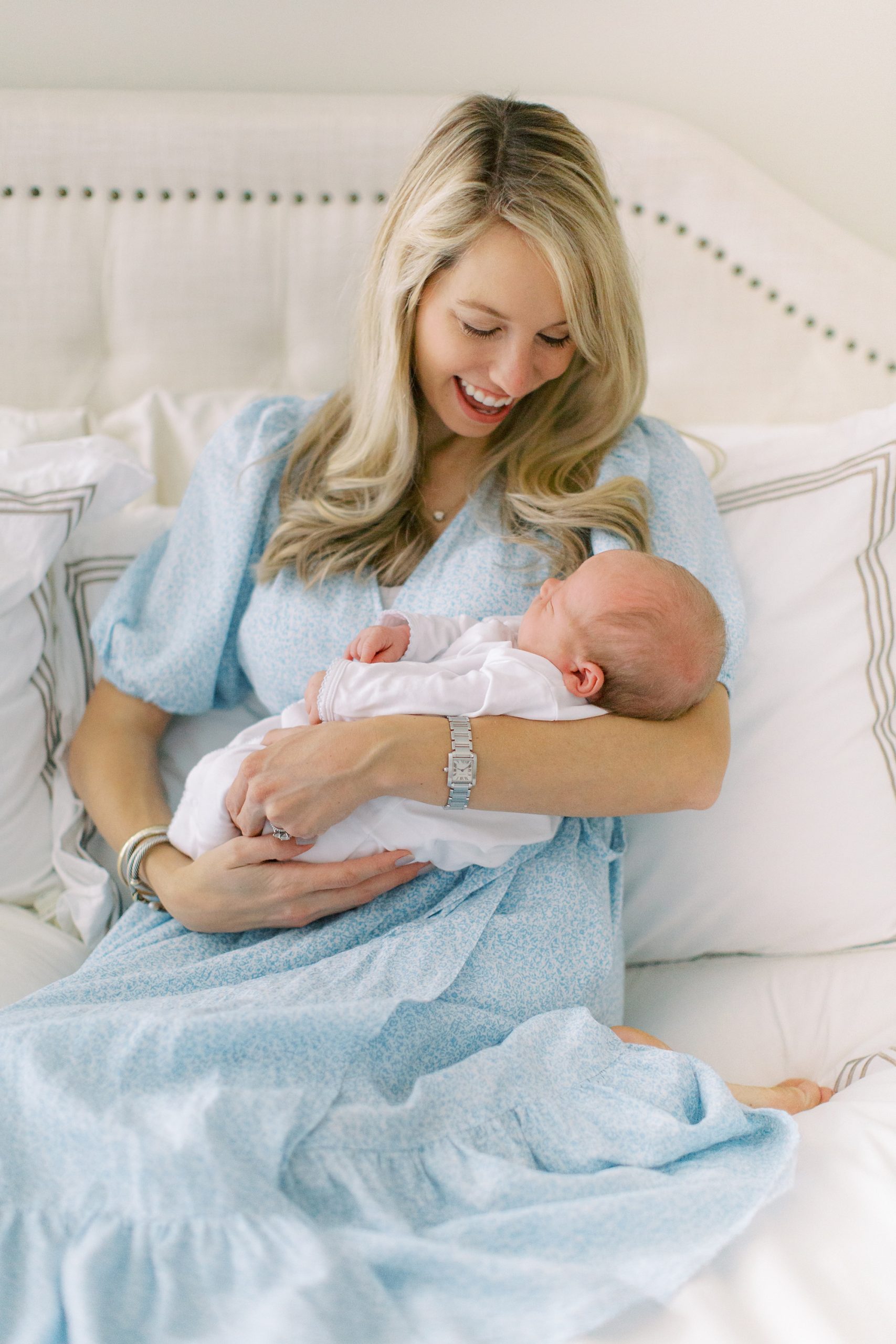 mom holds new son during Charlotte lifestyle newborn session