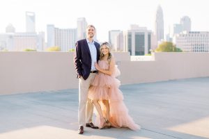 bride in Untamed Petals gown pose on rooftop in Uptown Charlotte