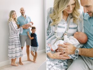 mom holds son with husband during NC newborn photos