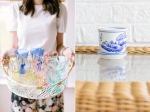 woman carries tray with vintage glassware