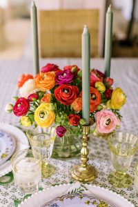 centerpieces with dark flowers and candles