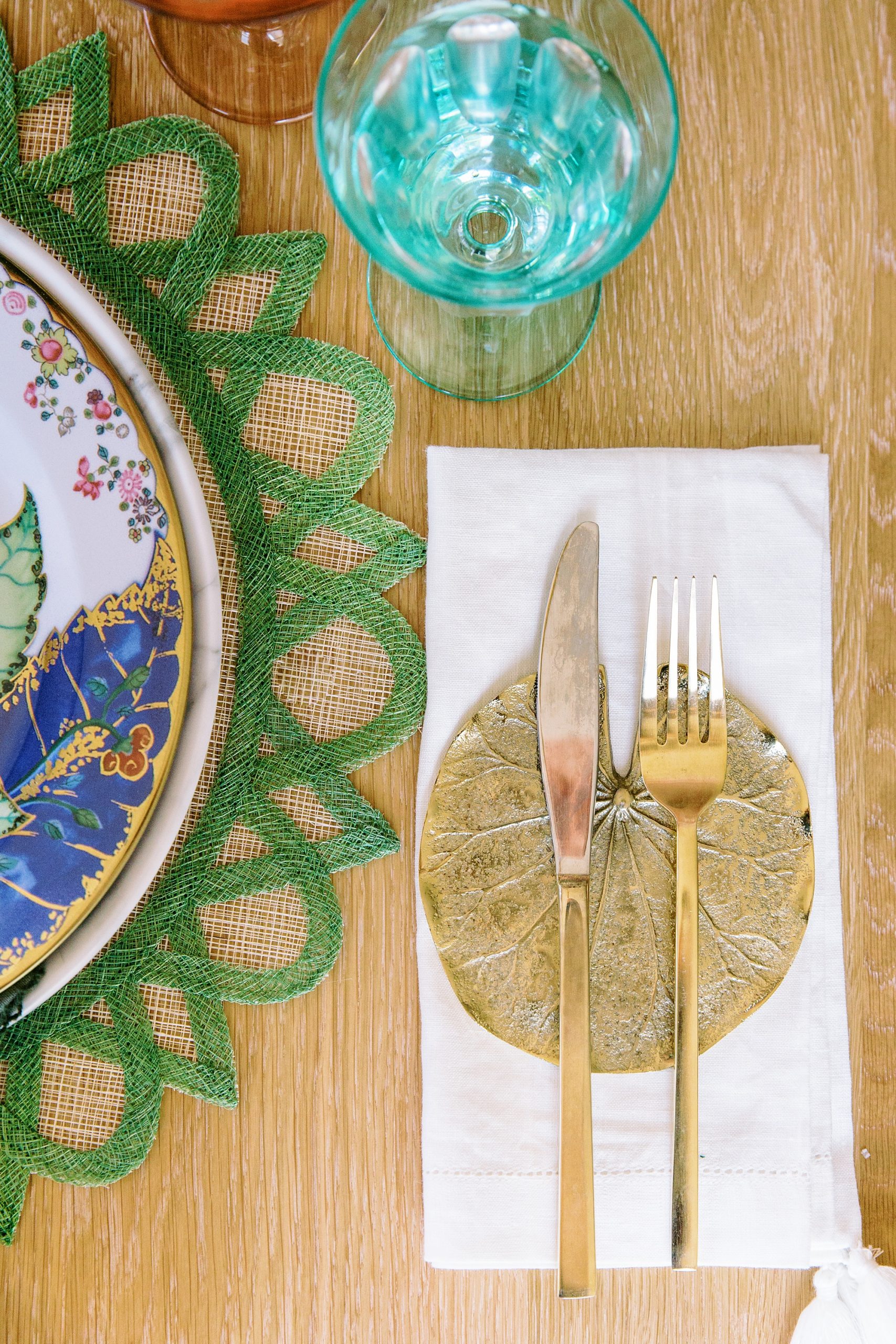 place settings with gold and green details during Charlotte product photography session