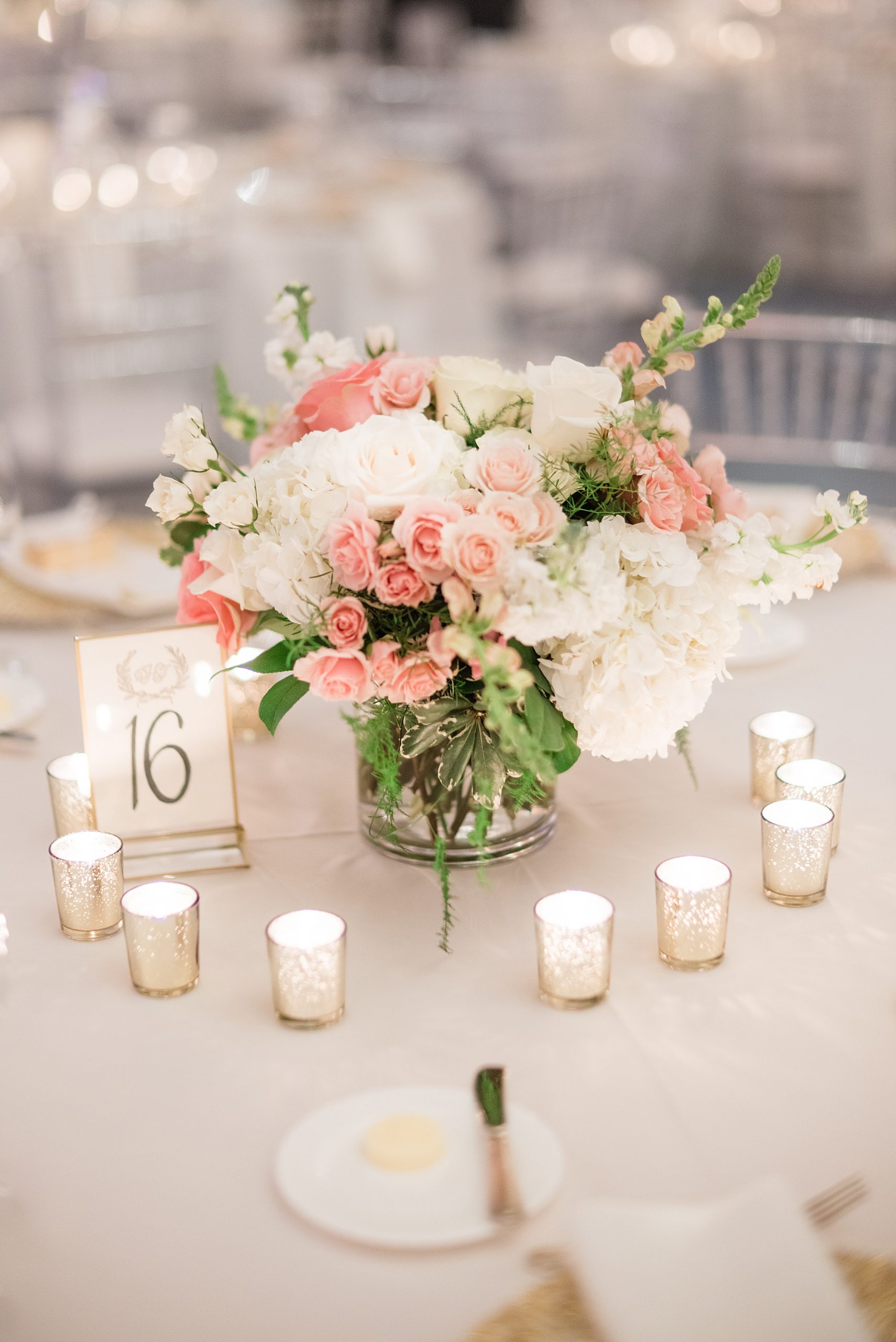 centerpieces with pink and ivory flowers