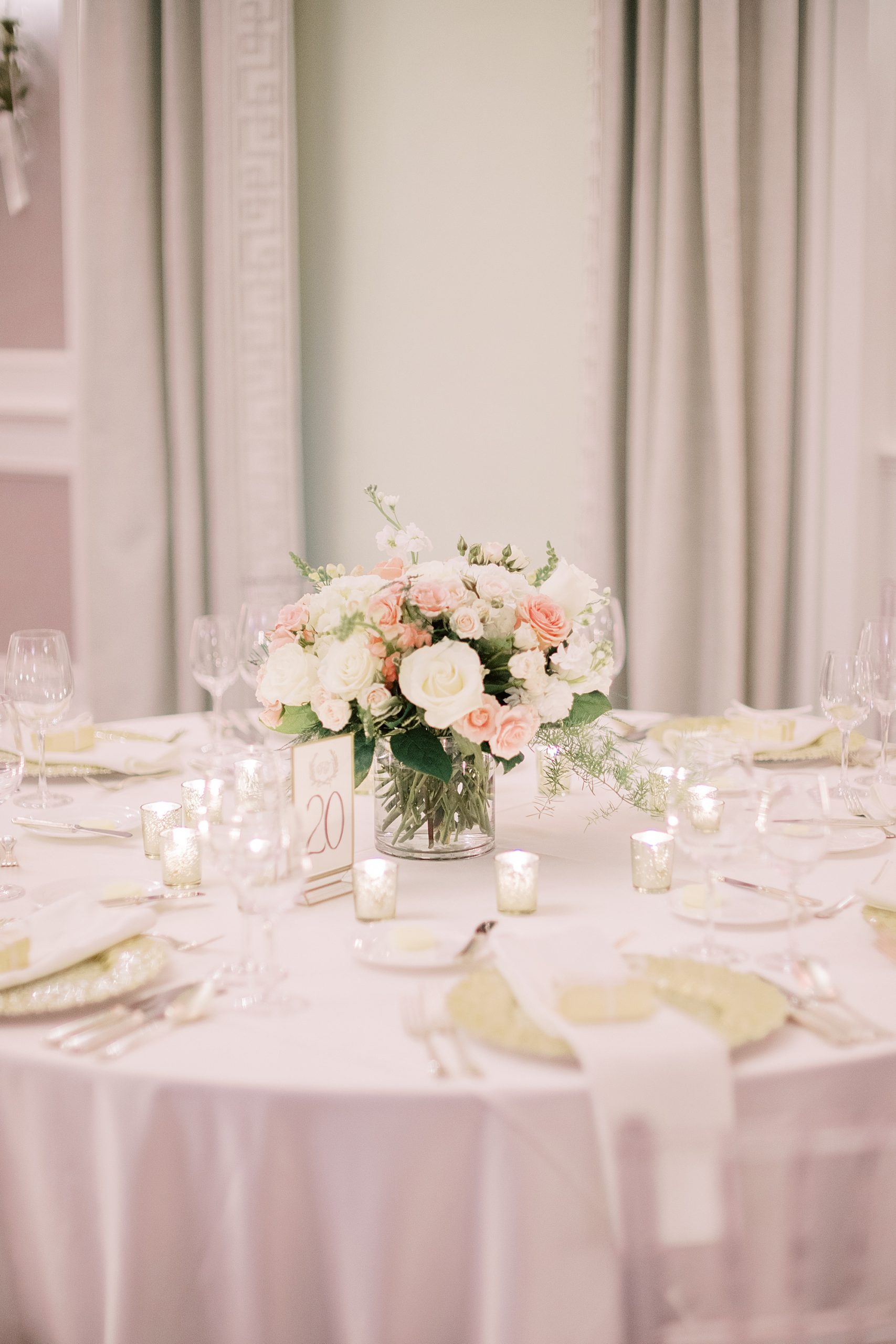 centerpieces with ivory and pink flowers