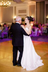 bride and father dance together