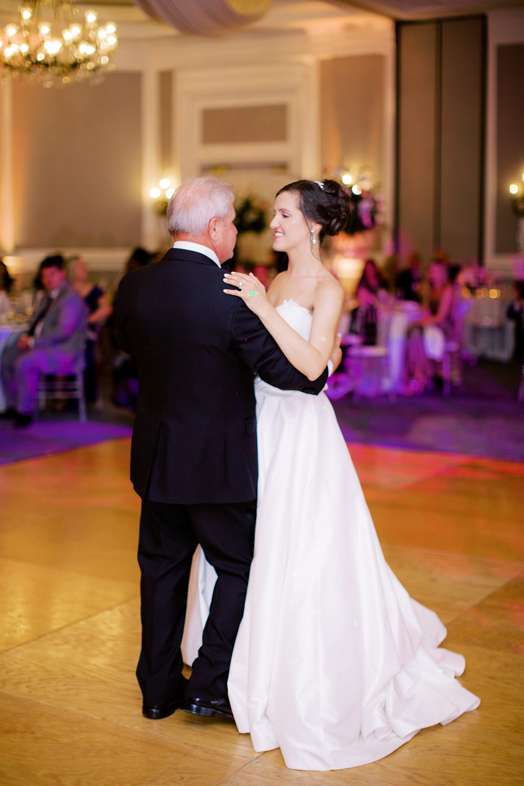 bride and father dance together
