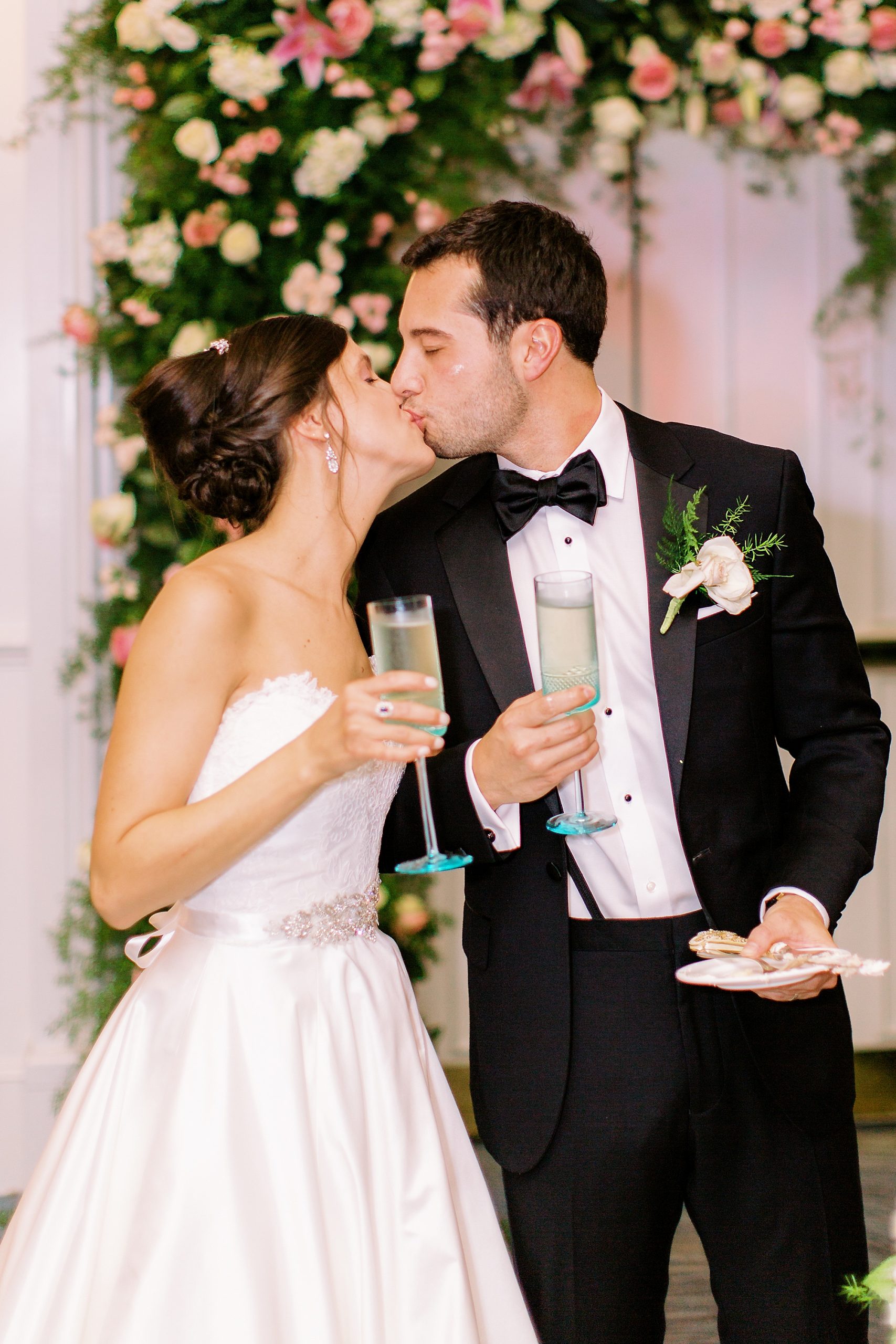 newlyweds kiss after champagne toast