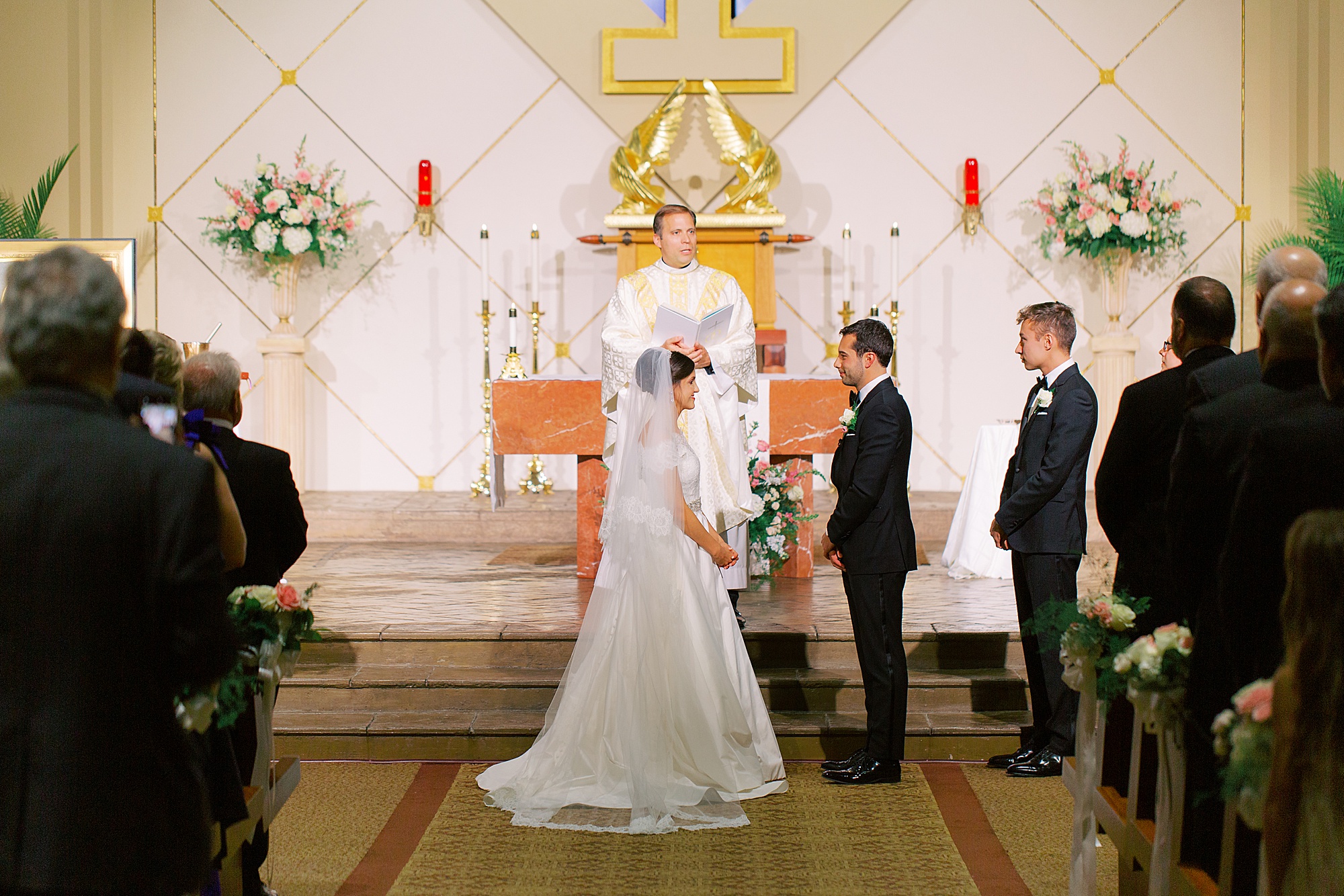 bride and groom exchange vows during traditional church wedding in Charlotte NC