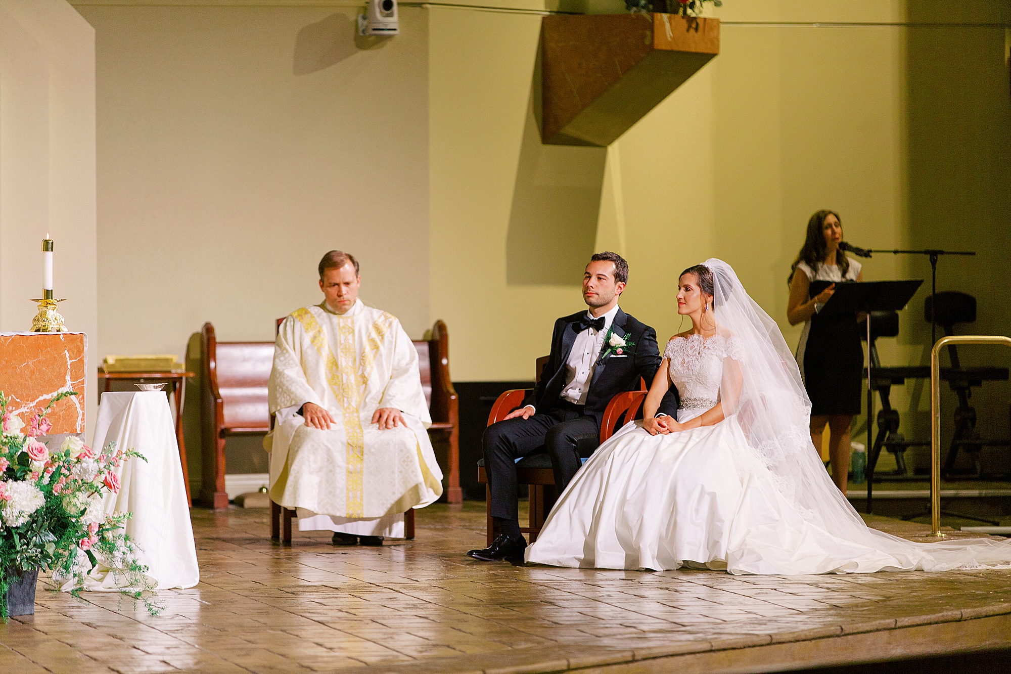 newlyweds sit in church during traditional church wedding in Charlotte NC