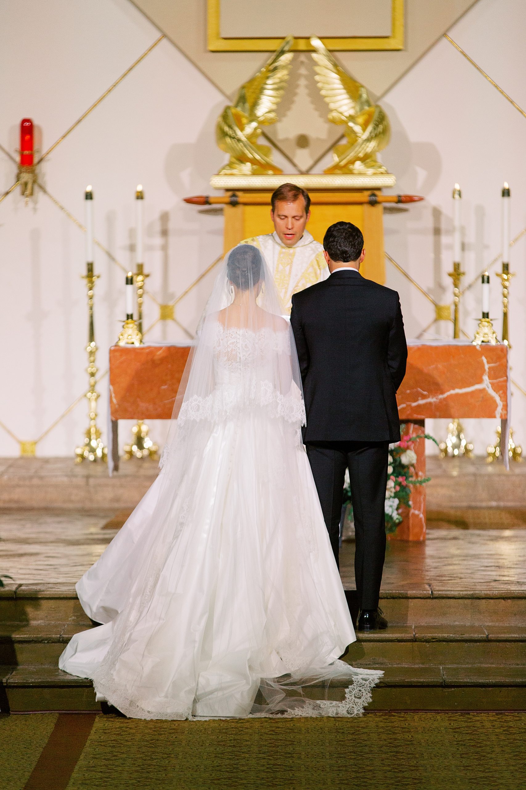 bride and groom stand before altar during traditional church wedding in Charlotte NC