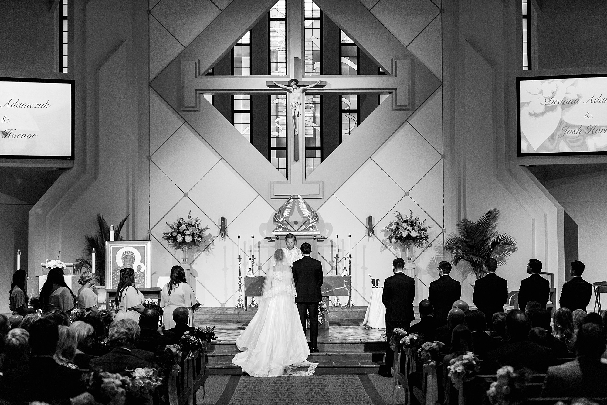 newlyweds kneel at alter during traditional church wedding in Charlotte NC