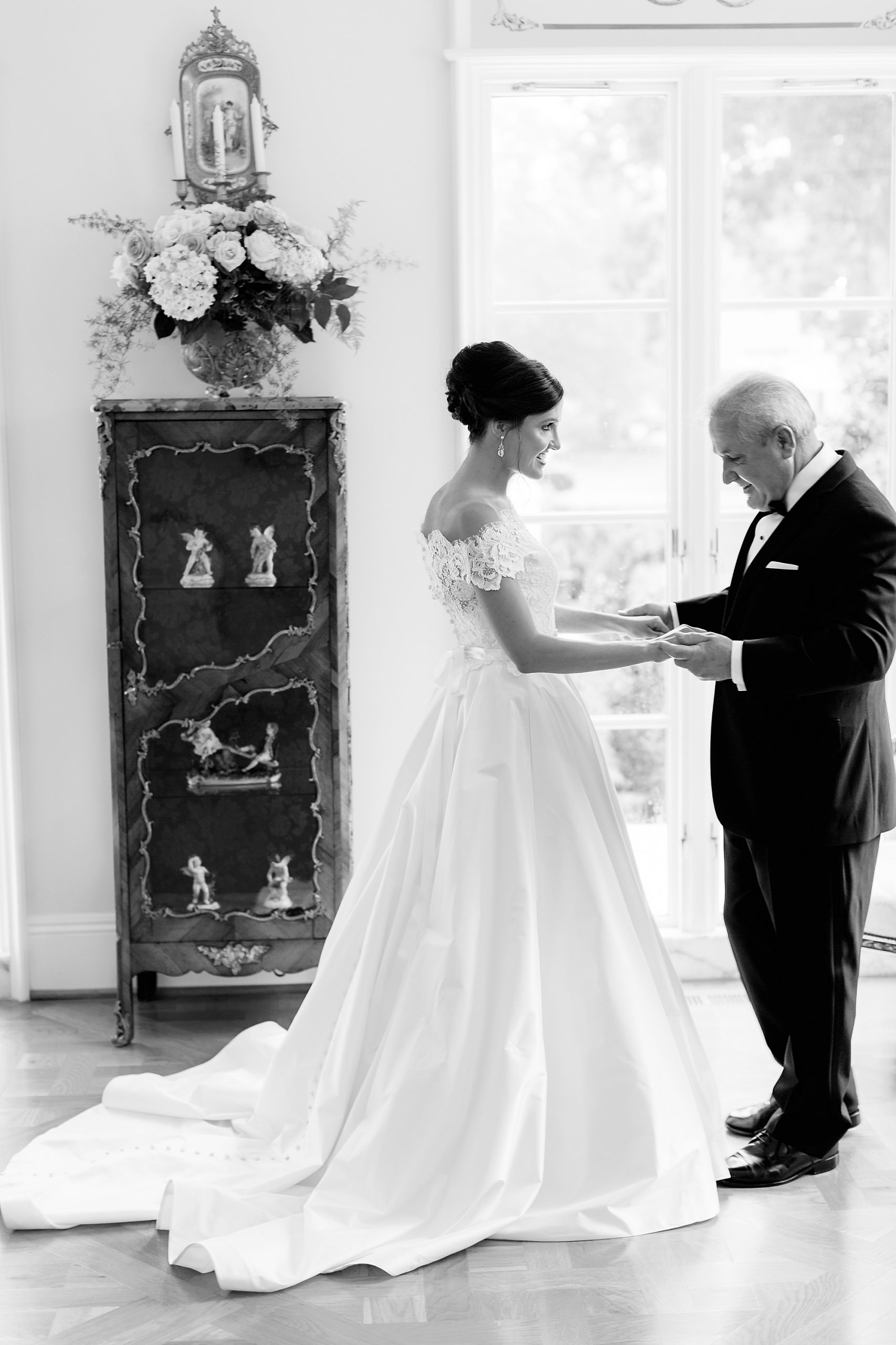 father looks at bride during first look