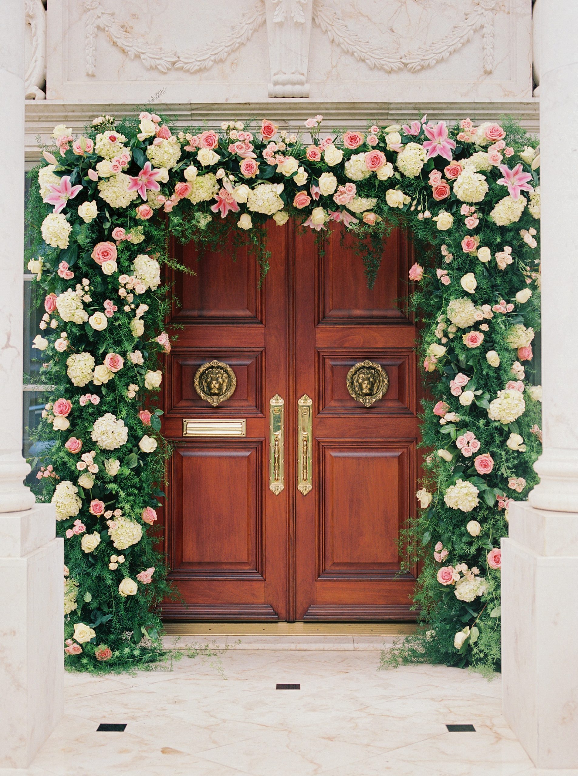 floral arch around door at Ballantyne Country Club