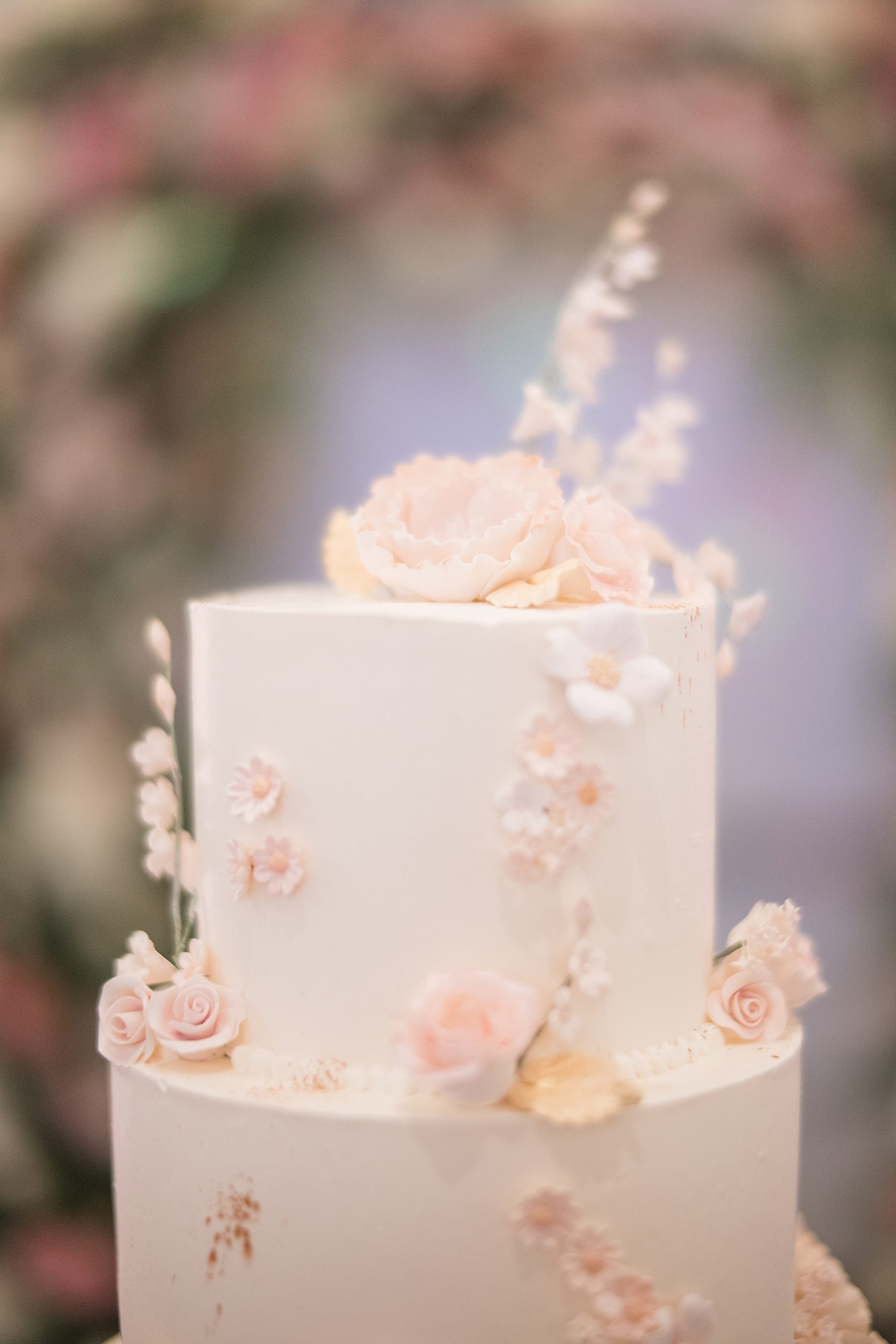 wedding cake with florals on top