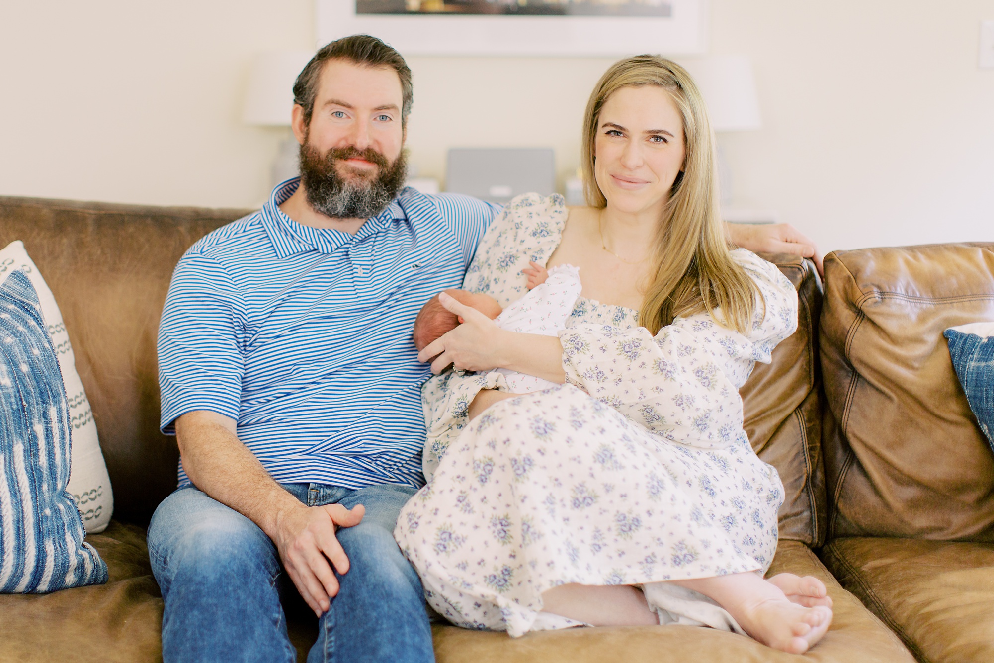 new parents look at baby girl during Charlotte newborn photos