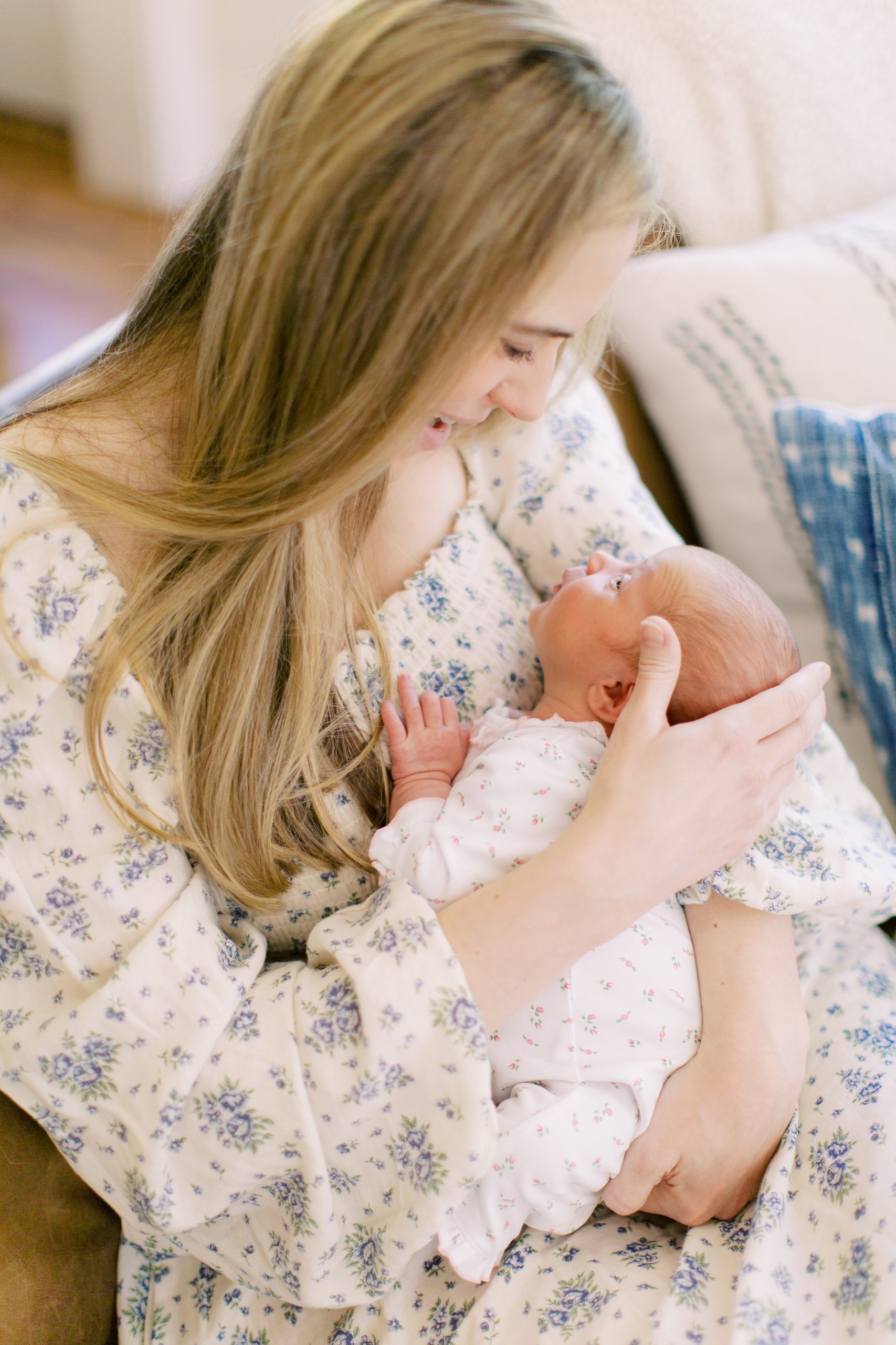 mom holds baby girl in Charlotte NC nursery