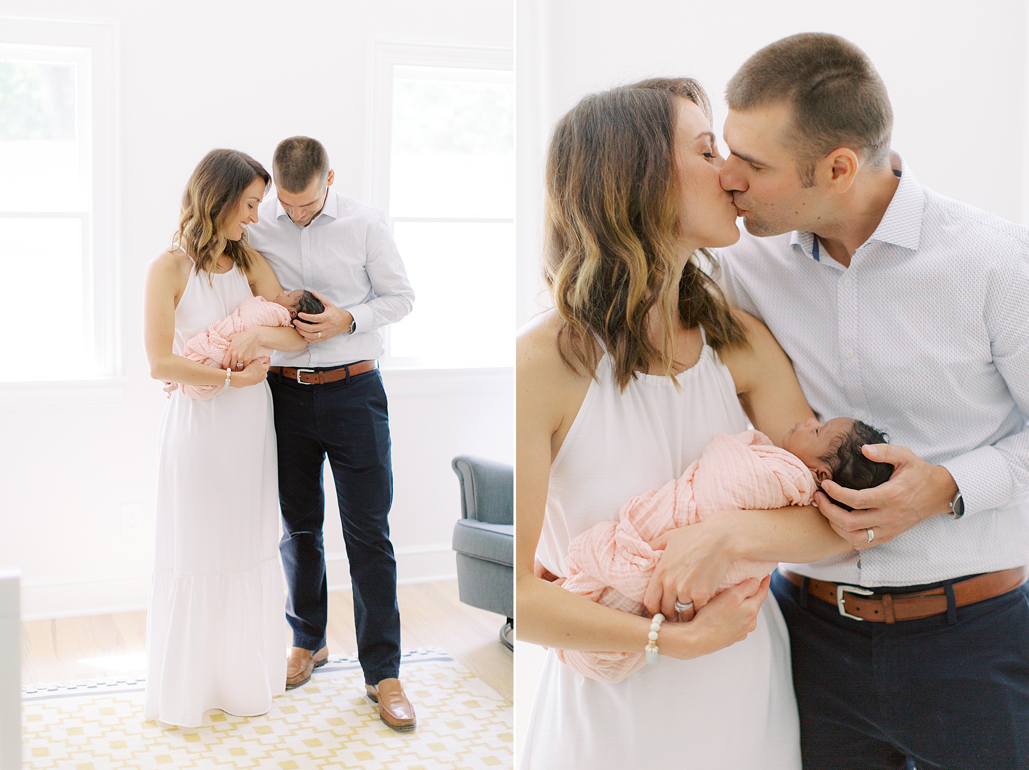 parents kiss during newborn photos at home