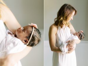 mom holds baby girl during newborn session at home