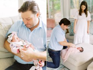 dad holds baby girl and swaddles her during newborn photos