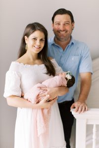 new parents old daughter during newborn photos at home