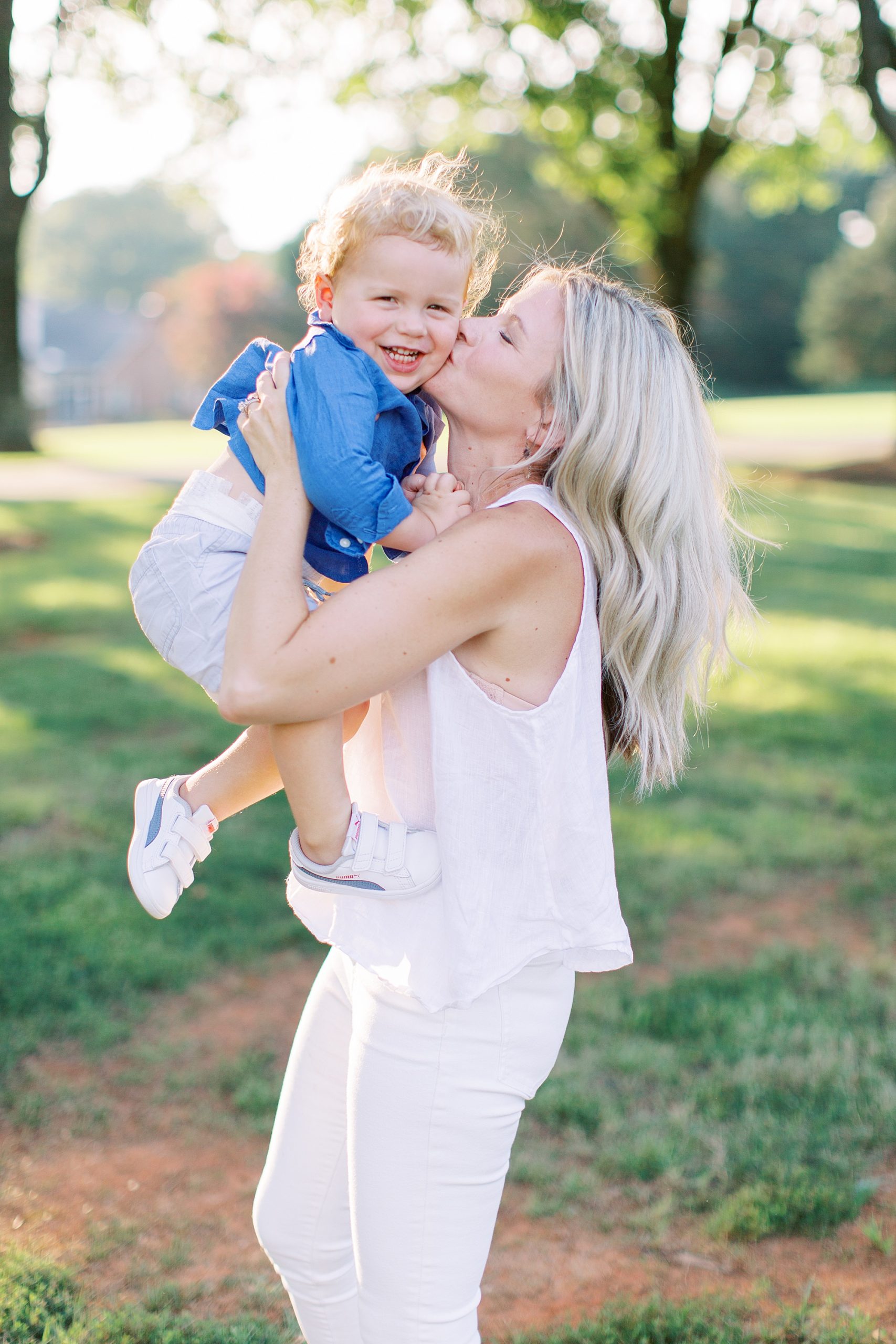 mom kisses son during Charlotte family photos