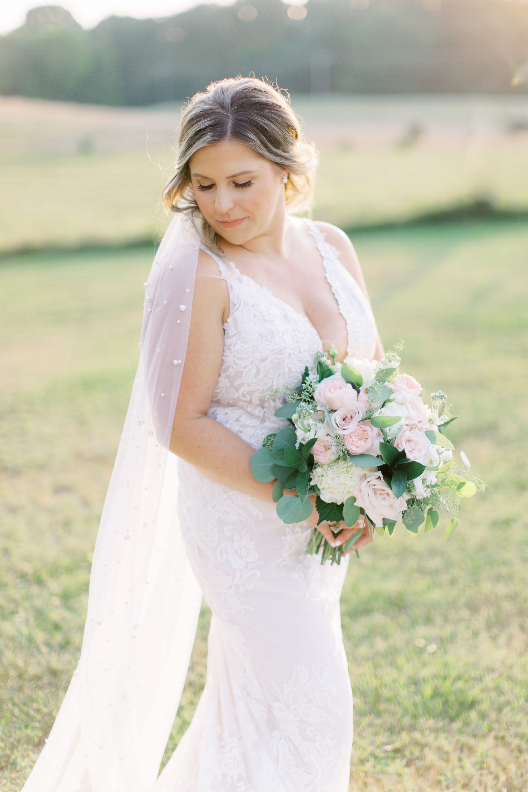 bride looks over shoulder during The Dairy Barn bridal portraits