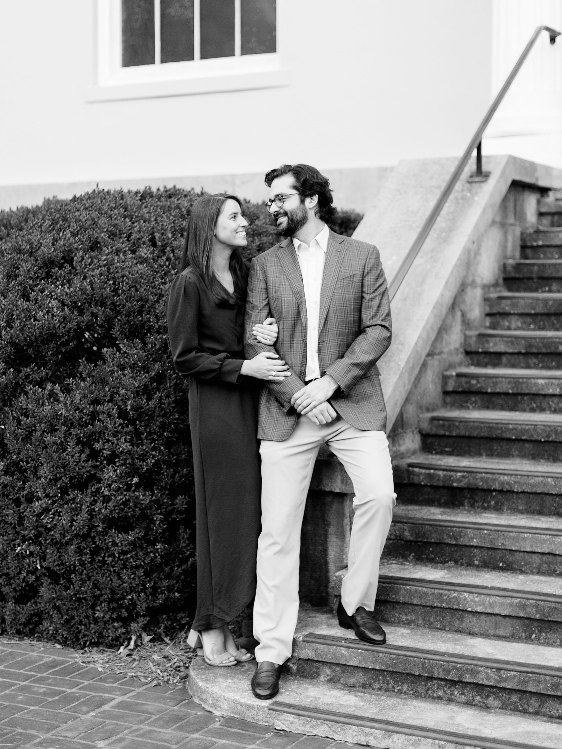 couple stands on the steps during Mint Museum Engagement Session