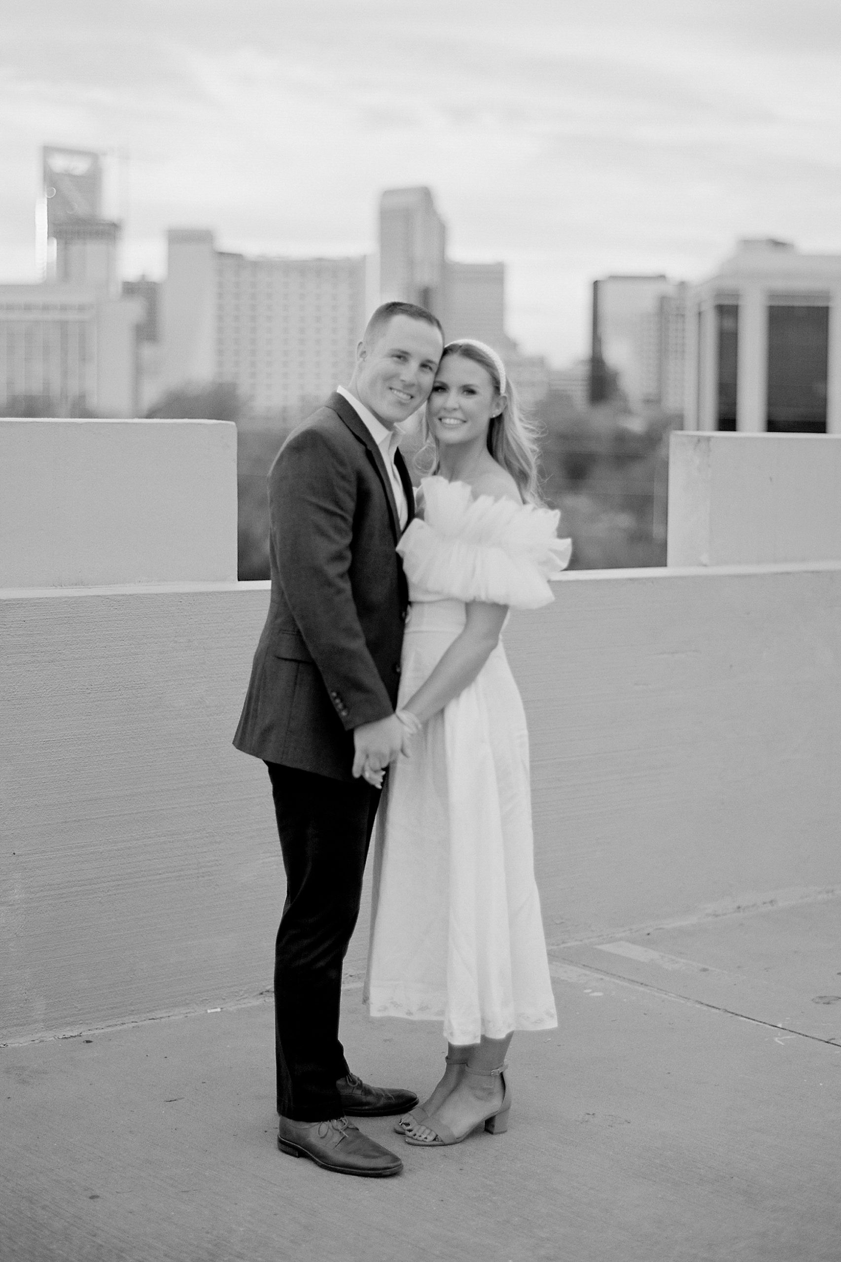 couple stands together hugging during Charlotte NC engagement session