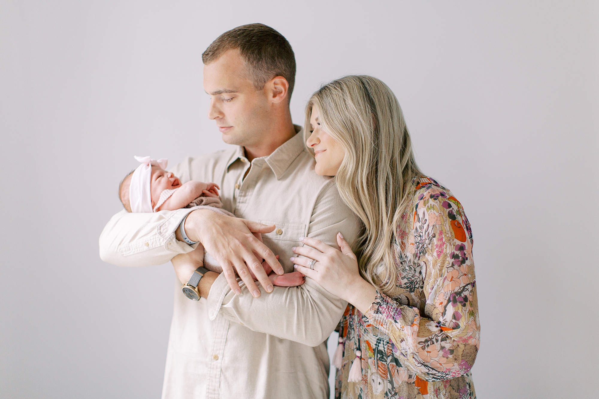parents look at daughter during Charlotte newborn session