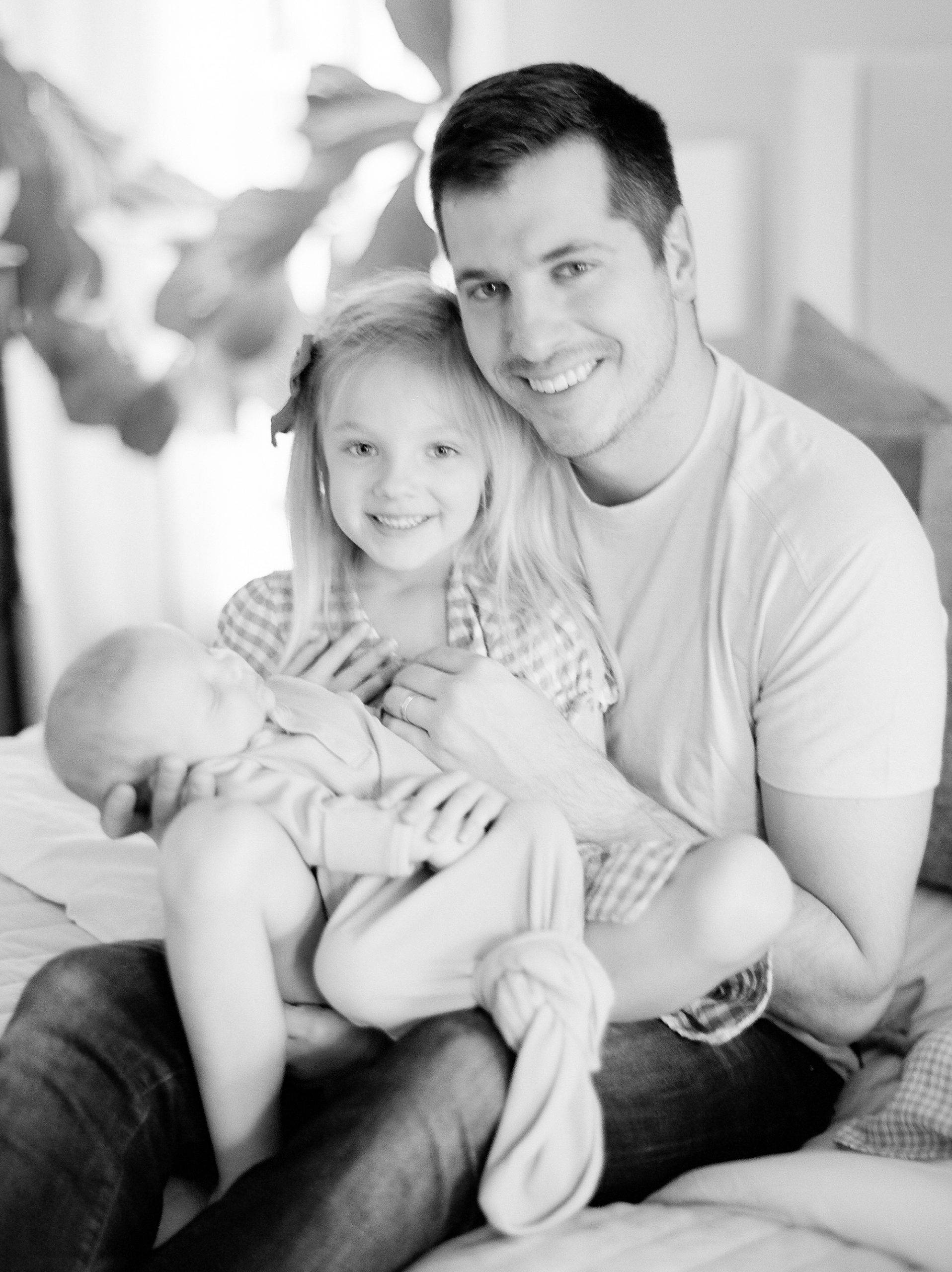 dad holds daughter and new son during Charleston SC newborn session