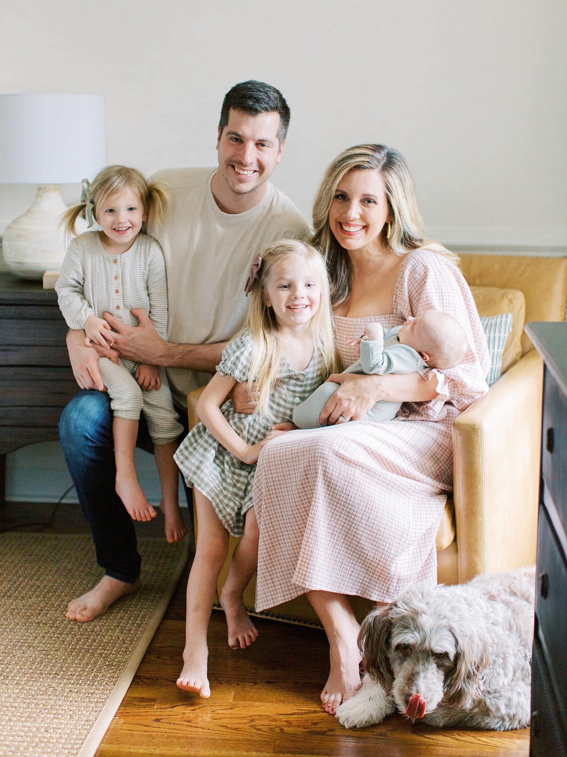 family of five sits together during Charleston SC newborn session
