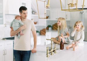 dad holds new son while girls sit on counter eating