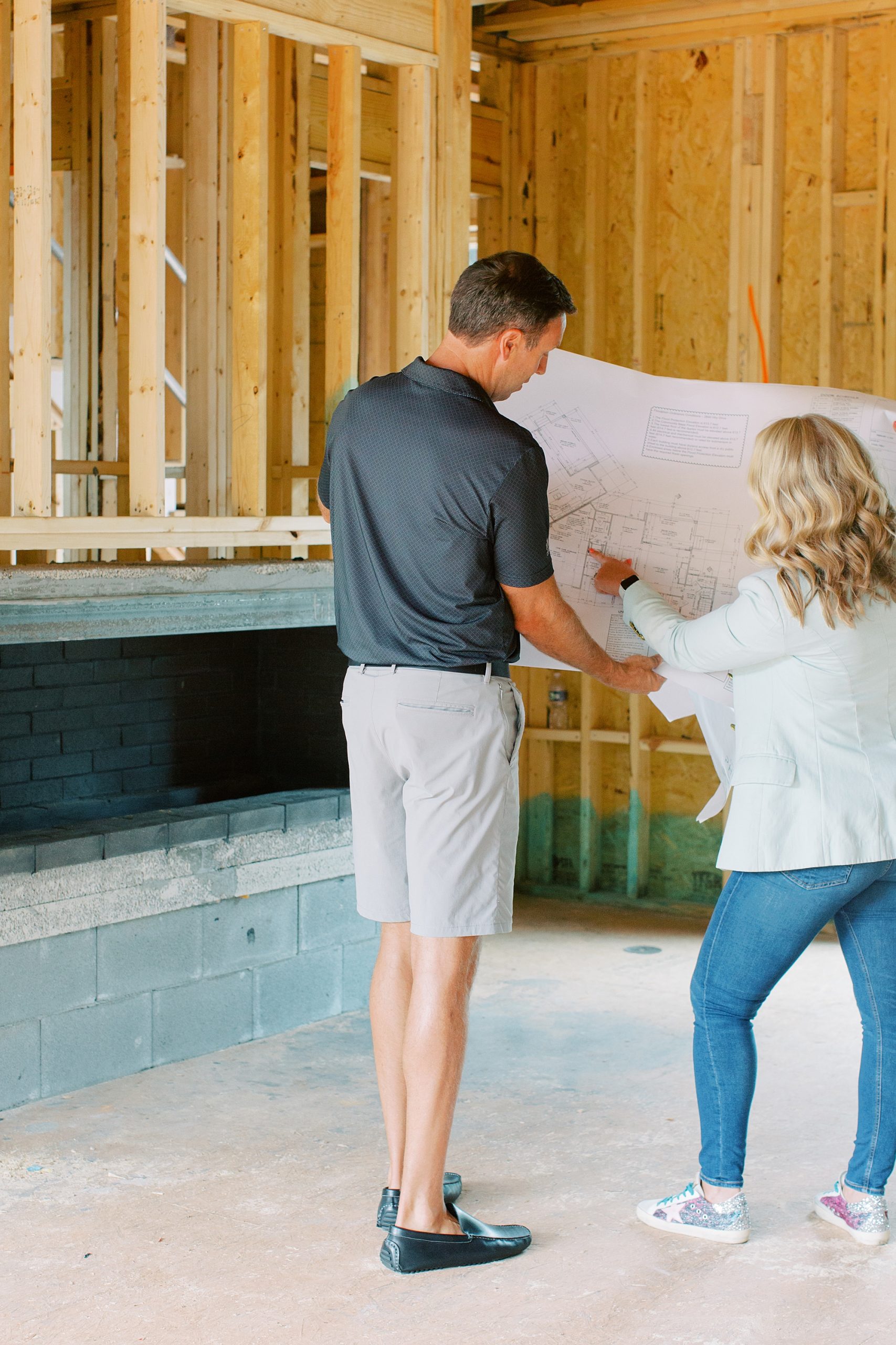 McCormick Custom Construction team looks at blueprints in custom home