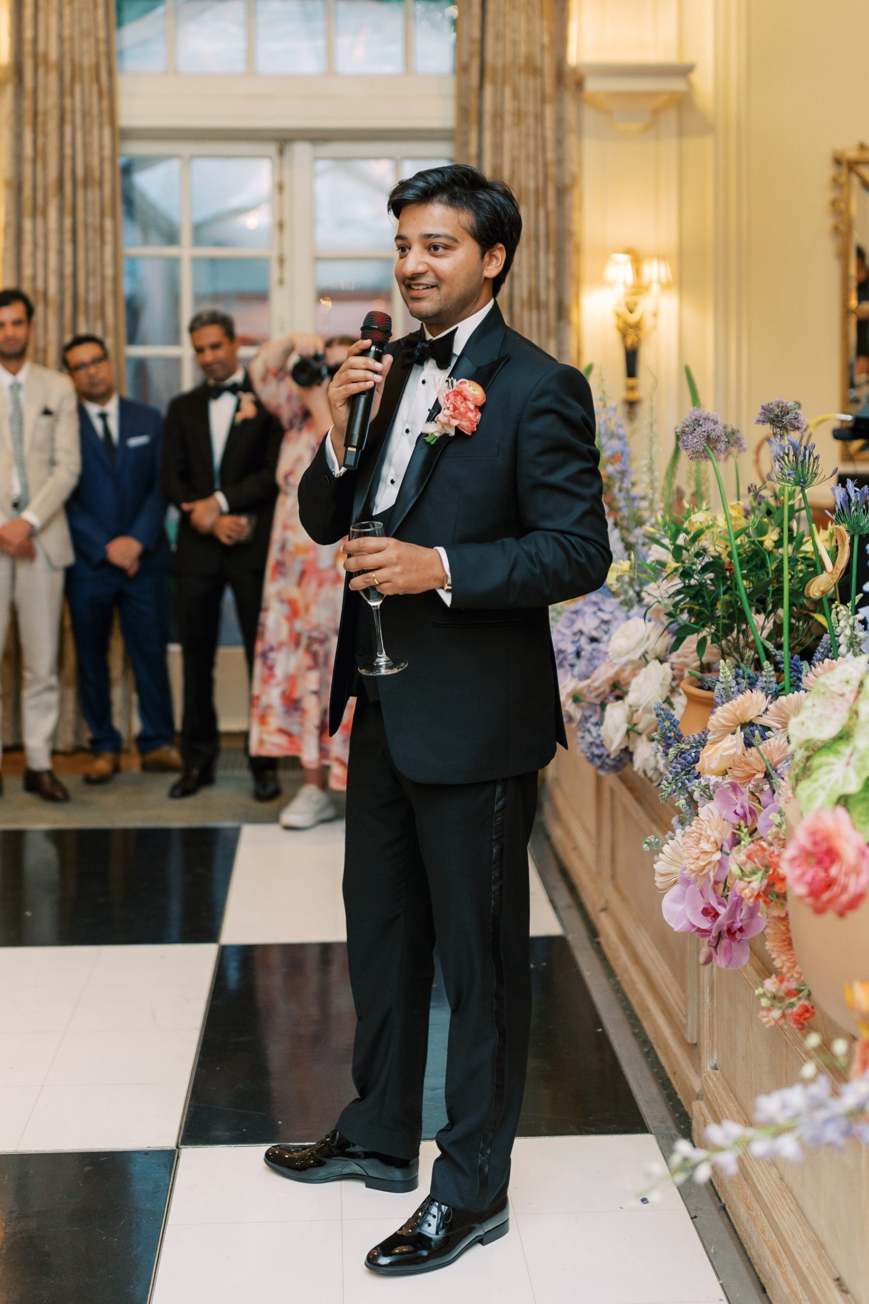 groom gives speech inside Duke Mansion during reception 