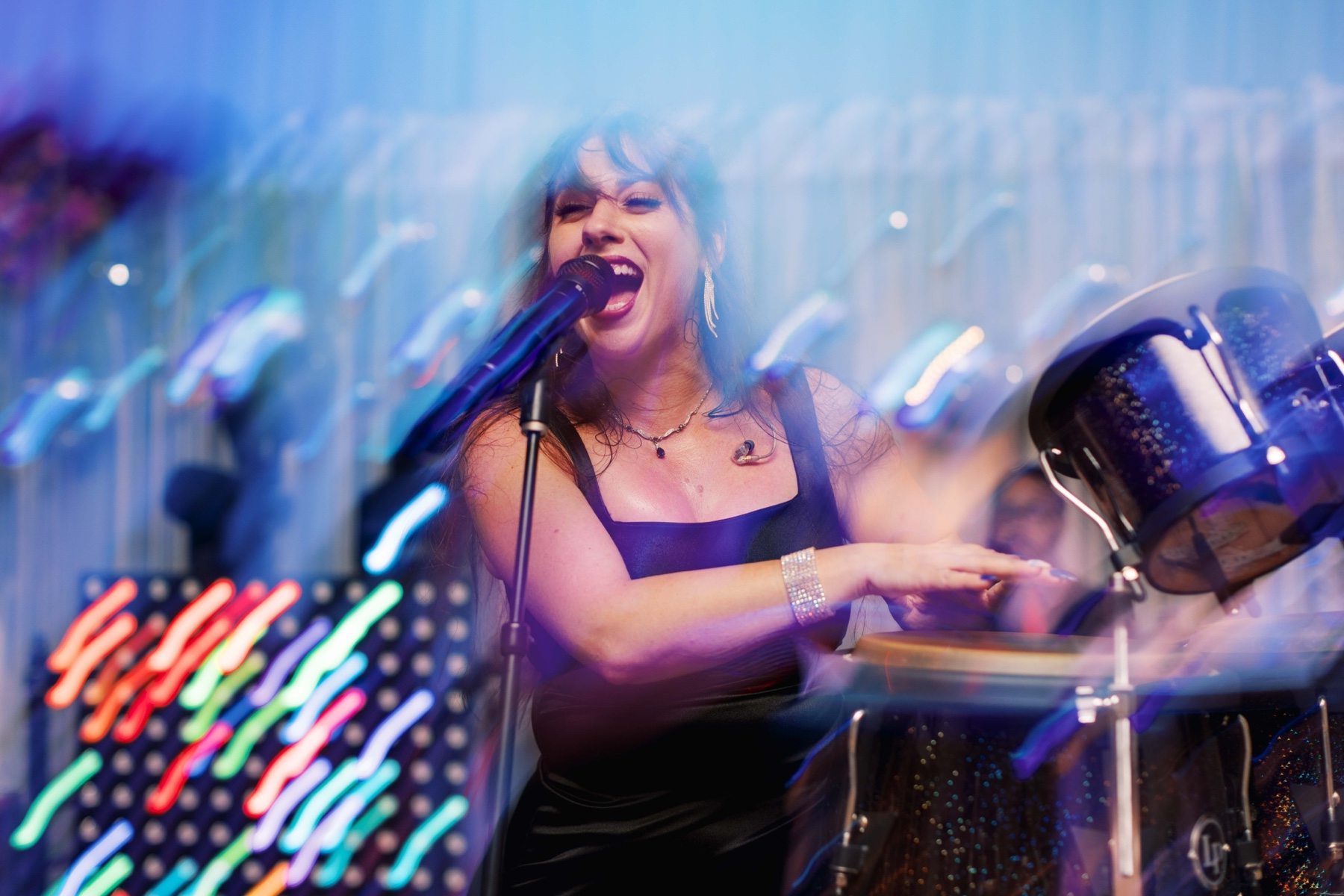 live musician sings and plays drums during Duke Mansion wedding reception 