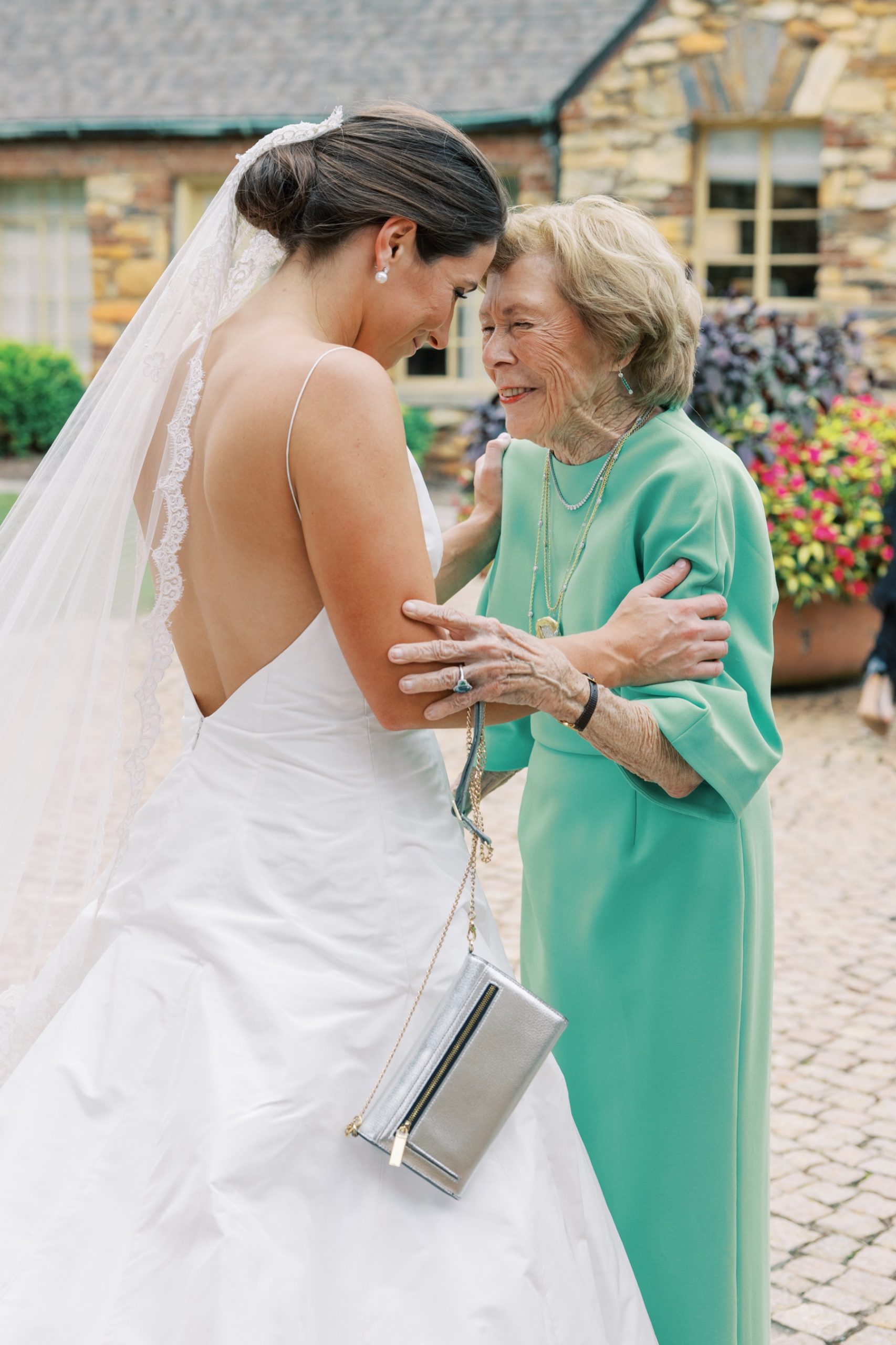 emotional and joyful moment between bride and family member