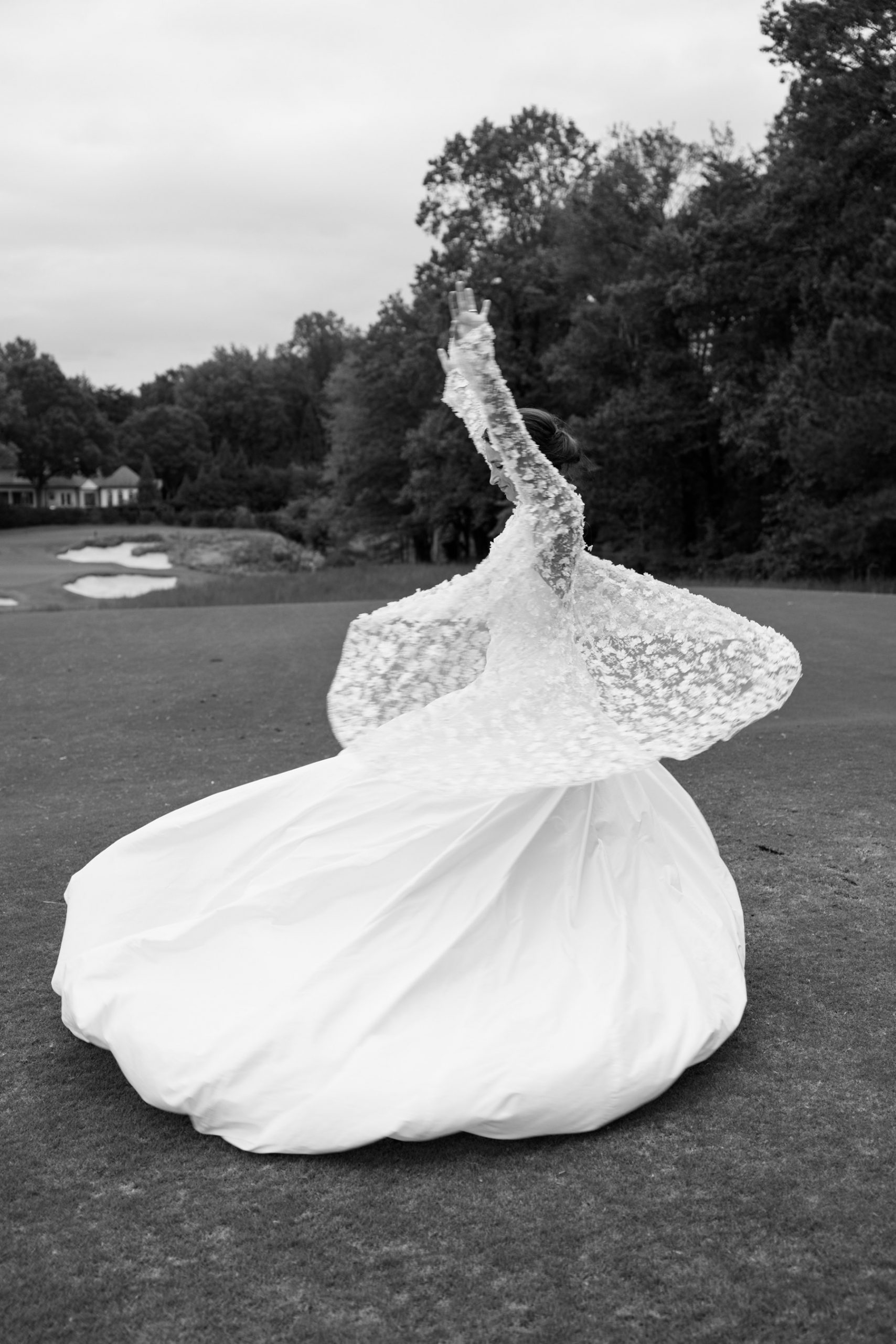 Canid photo of bride twirling in wedding dress